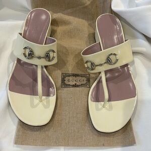 Guccis bone/ ivory patent leather sandals from Spring 2015 collection.